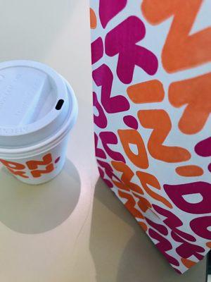 Donut and small black coffee ( This coffee is blazing hot). Insane