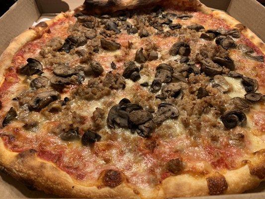 Traditional large pie with mushrooms and sausage