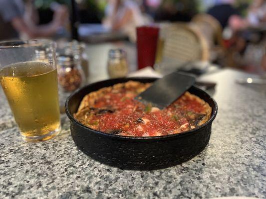 Small deep dish pizza.  And cold beer.