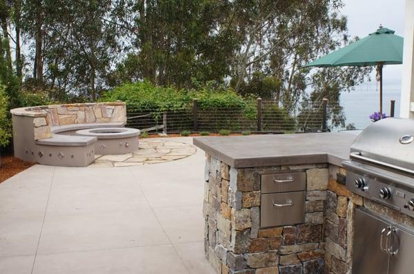 Small Kitchen and fire pit with an ocean view.