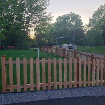 cedar picket fence with 4 gates.