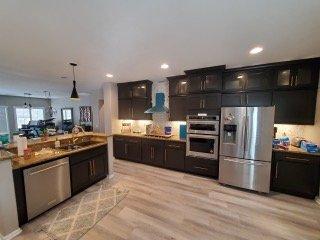 Added over cabinets on existing wall cabinets and refinish