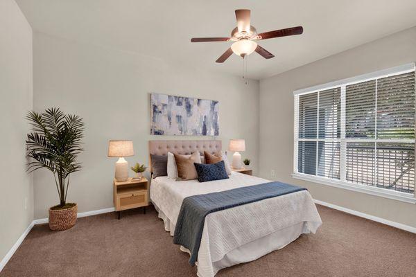 Bedroom with ceiling fan at The Estates of Northwoods