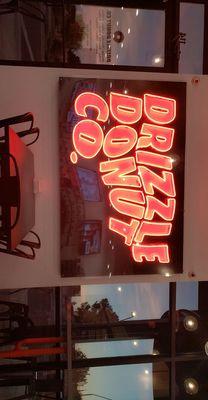 Drizzle Donut co. neon sign.