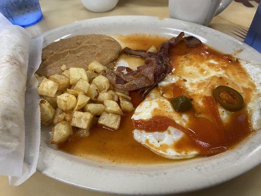 Eggs, bacon, beans, and hashbrowns.