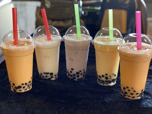 Variety of boba flavors pictured Thai tea, Taro, Peach and Mango