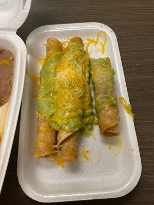 Three rolled tacos. Missing sour cream