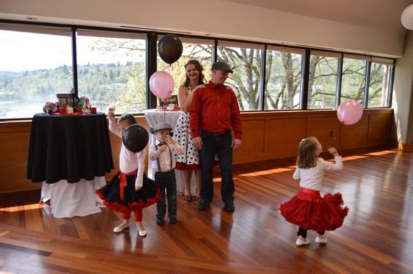 Newlyweds and their children enjoying the Tumwater Room.