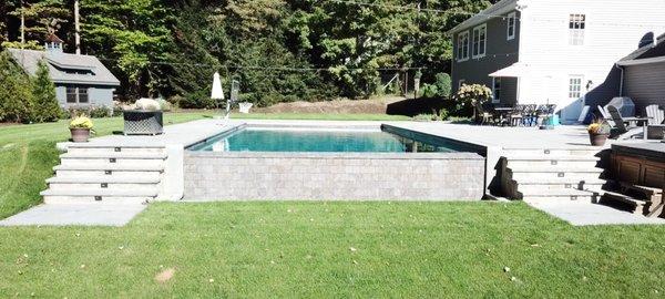 This is the view from below the pool, showing the tile wall below the vanishing edge, where the water fall is.