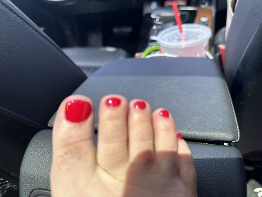 Gel pedicure done at this place the color is red and the number is 007 of the gel .