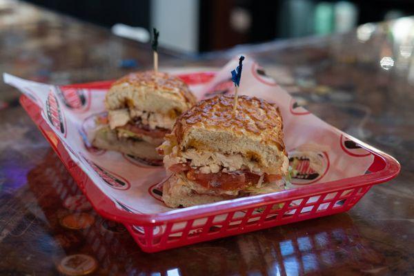 Try the Jail Bird Sandwich at The Sandwich Spot -Marinated Chicken, Cranberry,Bomb Sauce, and Pepper Jack Cheese for a delicious experience