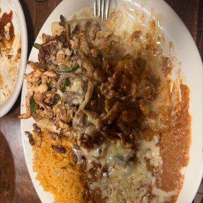 Enchilada's topped with Chicken and Steak