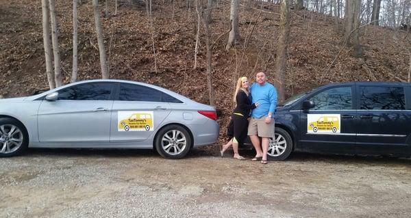 My wife and I with two of our vehicles. We're a family run service.