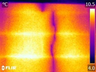 Infrared scan of cracked chimney showing cold air leakage