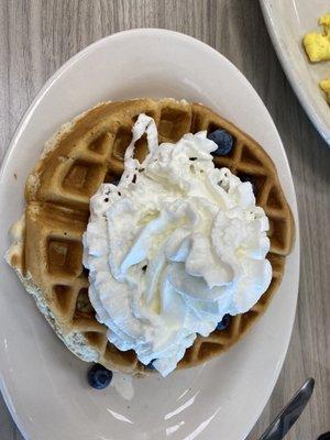 Belgian Waffle with whipped cream and blueberries