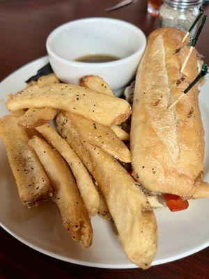 Philly cheesesteak and steak fries.