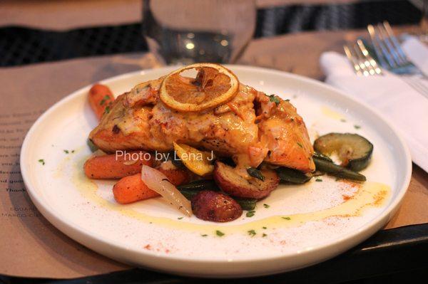 Trancio di Salmone ($35) Grilled salmon covered with a light cream of dried tomatoes, paprika, red chili pepper, garlic and basil.