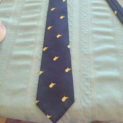 West Virginia gold "logo" on blue necktie.