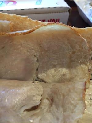 Previously frozen and then microwaved rotten turkey meat