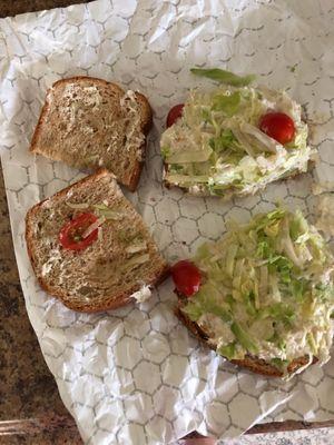 This is a Chicken Salad Sandwich with lettuce and tomato from this place, 1 grape tomato cut in 1/2...seriously?  Never again!