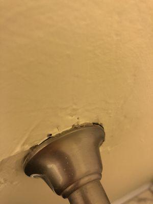 Paint gaps around towel rack guest bath downstairs.