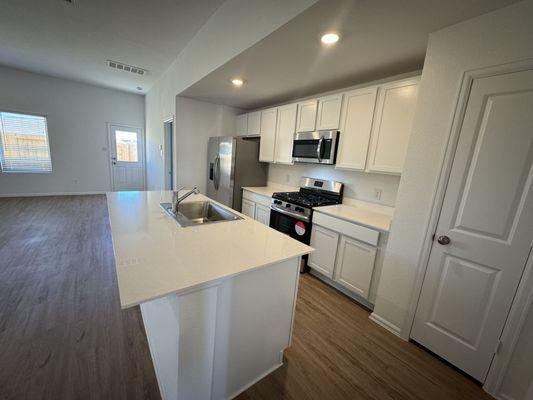 Discover this spacious Katy, TX kitchen with ample storage and a stylish design. The heart of your new home!