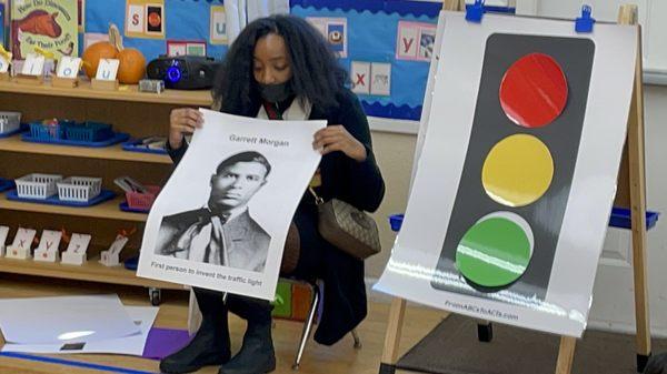 A black presentation history about the first person to invent the traffic light Garrett Morgan