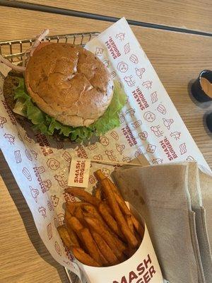 Spicy Baja With Guac Black Bean Burger and sweet potato fries.