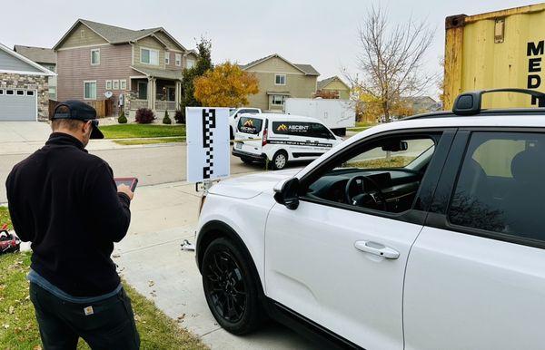 Recalibrating the drivers assistance system on this Kia Telluride following a windshield replacement