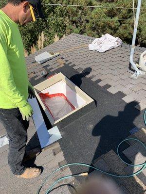 Skylight installation, with curb frame, flashing and tie in.