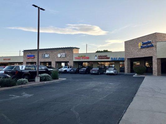 The exterior of Soda Bun and the neighboring businesses.