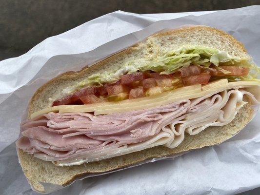 Ham, Swiss, turkey with lettuce, tomato and Mayo.