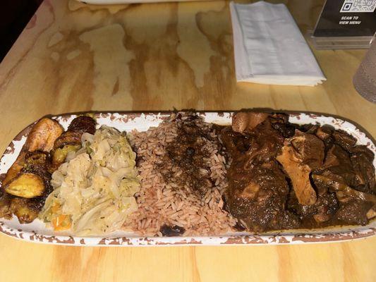 Oxtail platter with plantains, rice and beans and cabbage!