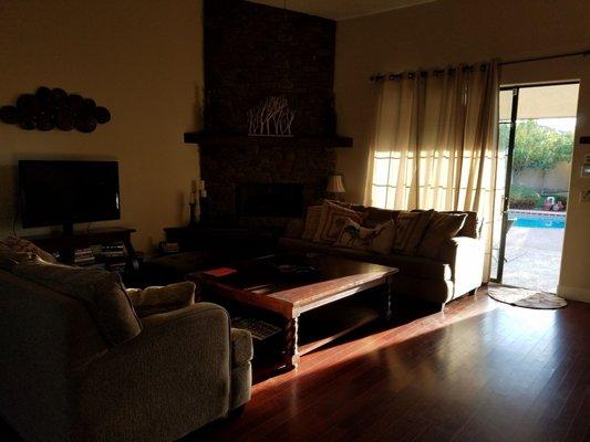 Living room and sliding door leading to the outdoor pool.