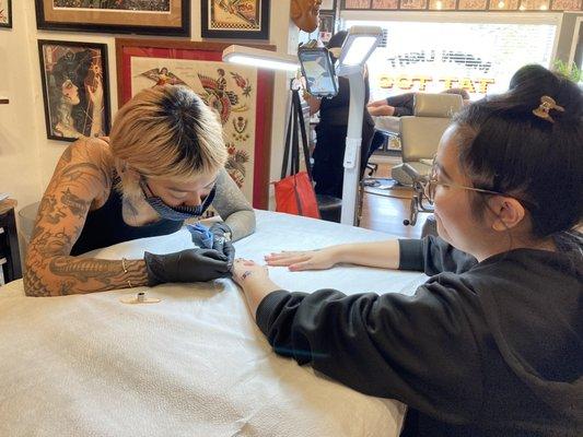 Getting my hand poked tattoo by guest artist Kiya Gloriani