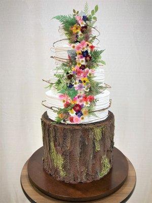 Nature inspired dried floral cake with buttercream tree trunk base!