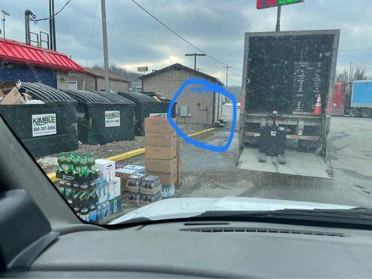 Truck unloading Coke products.