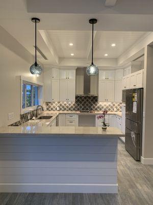 Shaker white cabinets with quartz countertop from Stone International Miami.