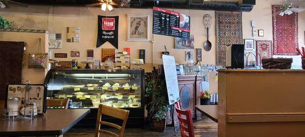 Welcoming space with some tasty pastries at the counter.