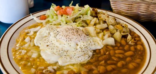 From a few years ago, Huevos Rancheros, over easy, with green chile.