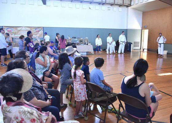 spectators watching karate demo at Obon