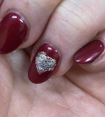 Beautiful deep red with a silver heart outlined in rose gold.