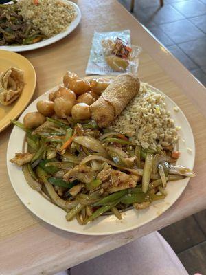 Hot and spicy chicken dinner combo with sweet and sour chicken and an egg roll for under $10!