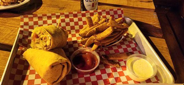 Buffalo chicken wrap with fries.