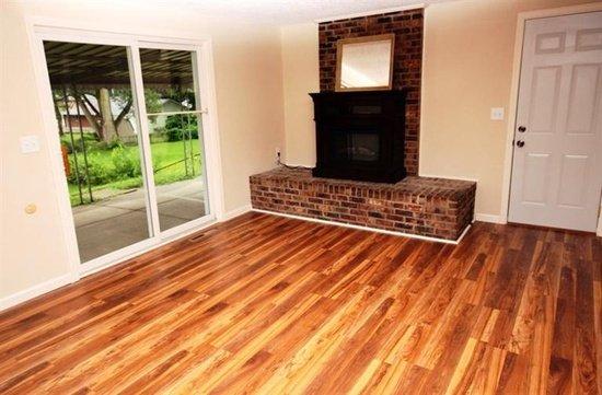 New laminate flooring. Fireplace, trim, paint, and patio door.