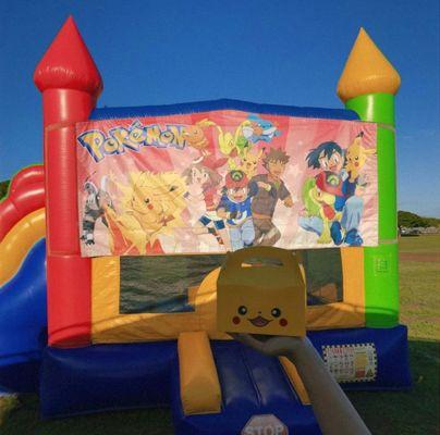 13x22 Bounce House w/ Slide, obstacle pillars, and basketball hoop inside. Perfect for all your keiki parties.