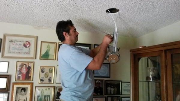 Miguel installing and wiring new canlight.