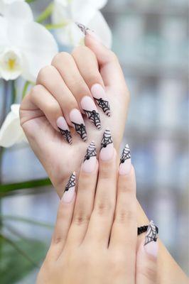 black spiderweb nails with rhinestones