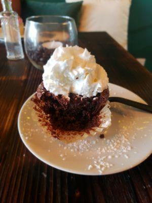 Gluten free chocolate decadence filled with a berry and port wine reduction,  topped with whipped cream.