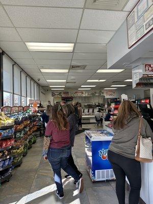 Inside of the store and Deli Towne ordering area and pick-up in the background.